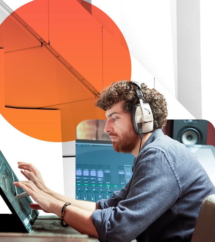 A person wearing a headset interacts with a digital workstation in a control center.