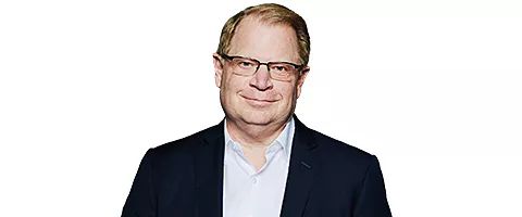 Professional headshot of John M. Hinshaw