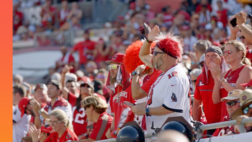 Tampa Bay Buccaneers fans cheer the team on at a game.