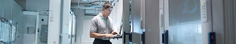 A person works in a server room