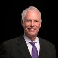 Headshot of business man Michael J. Roberts