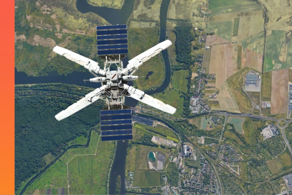 An aerial view of a satellite hovering above a green landscape