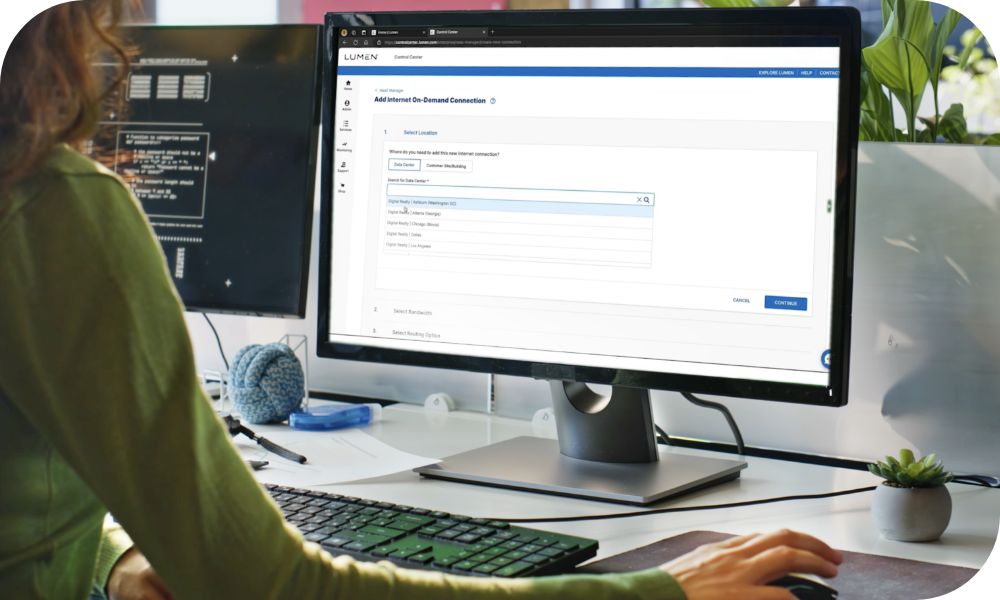 An individual adds Internet On-Demand through the Lumen Control Center on a monitor.