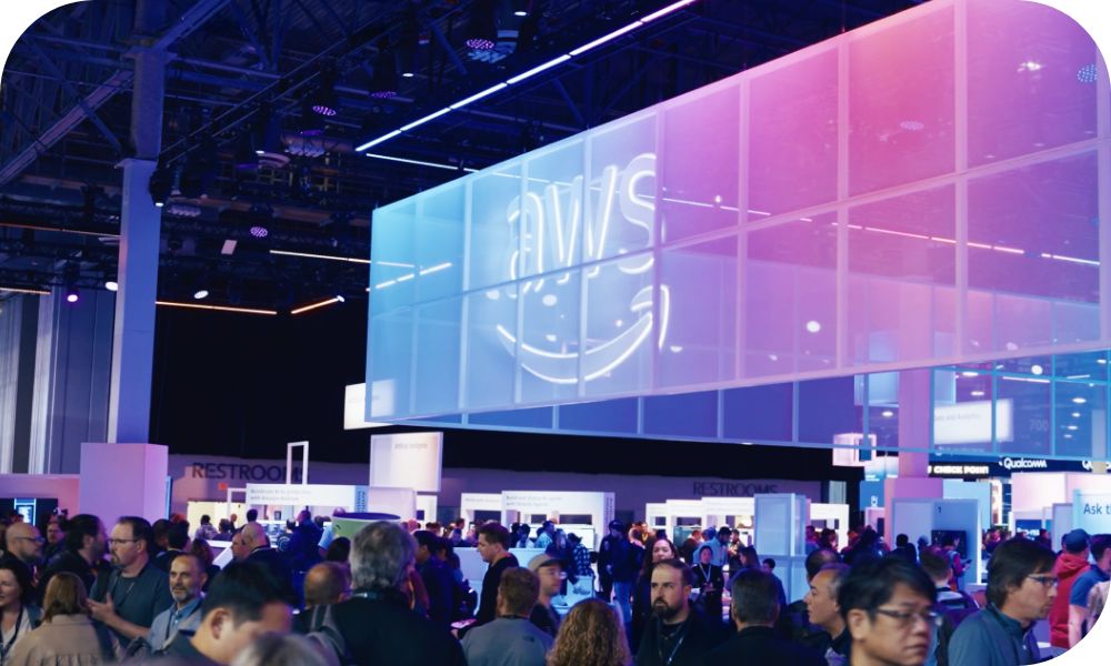 Two office mates discussion urgent issues at desk while reviewing data on computer tablet. 