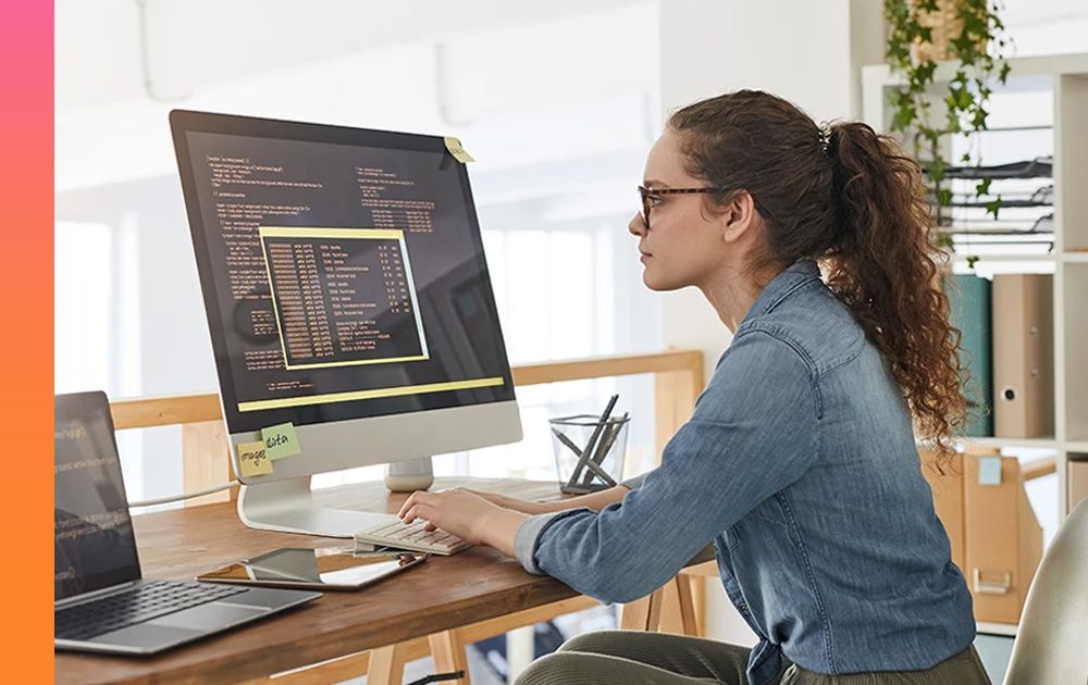 Woman working on desktop computer