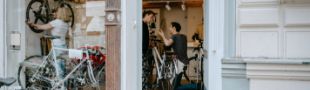 Two people in a bicycle shop.