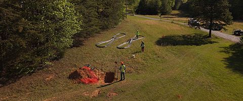 Aerial shot of Lumen workers preparing cable