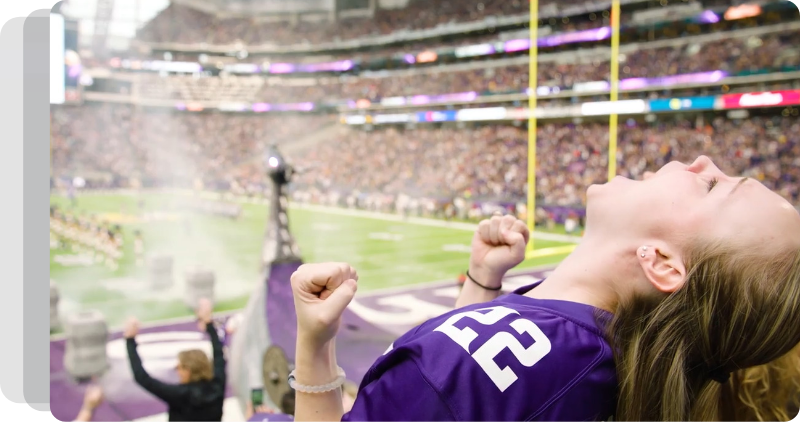 Girl cheering at Vikings stadium