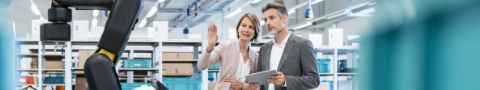 Business professional man and woman in discussion