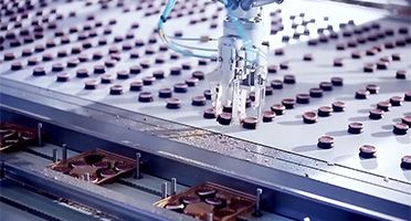 Automated assembly line with robotic arm