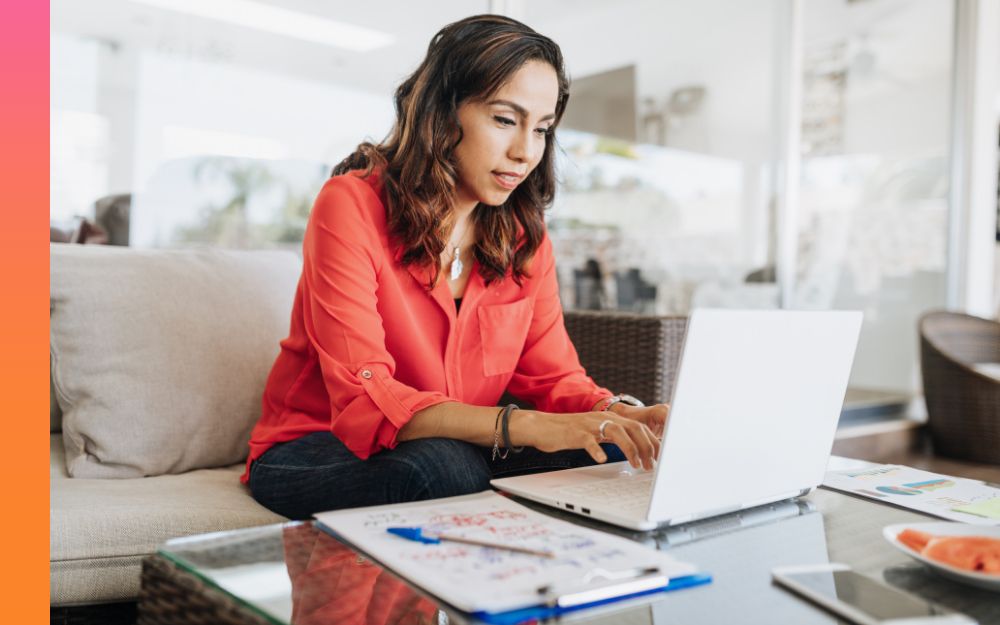 Woman working on a laptop at a table