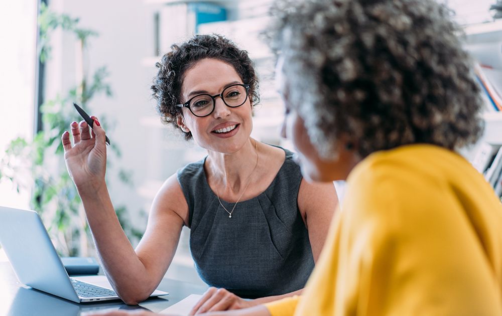 Businesspeople discuss something in an office