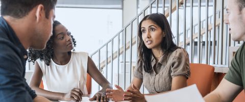 Two people meeting at a conference table