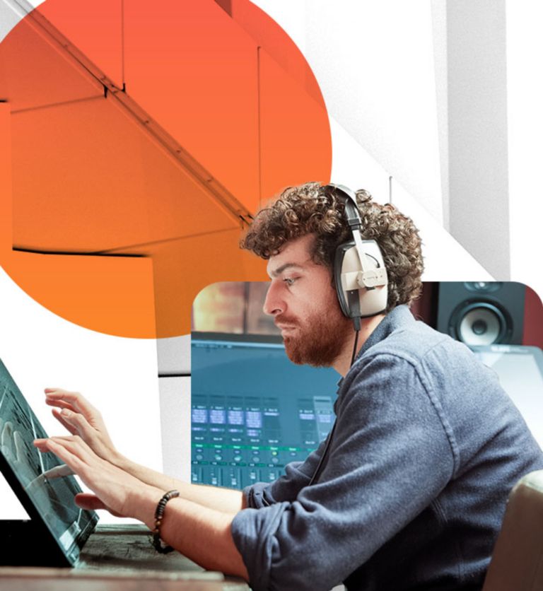 Video editor using touchscreen panel with headphones on editing live broadcast images.
