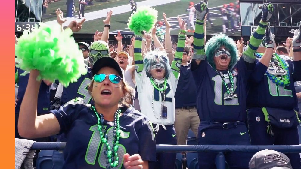 Tampa Bay Buccaneers fans cheer the team on at a game.