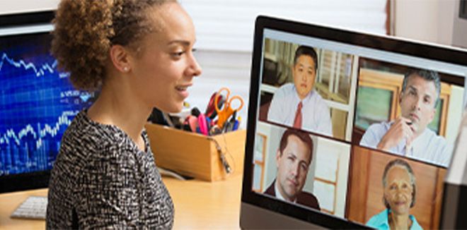 Side profile of a woman on a video call with four people